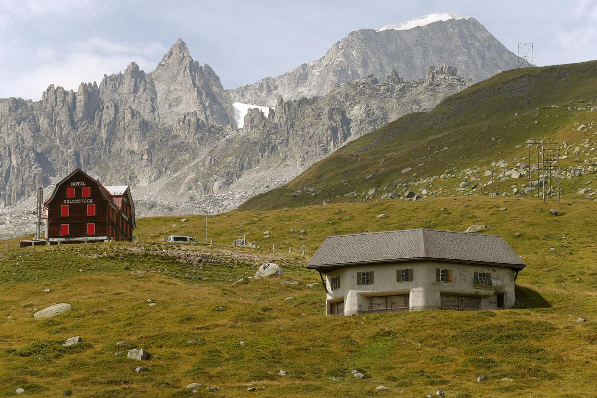 A machine-gun bunker, part of a former Swiss artillery fortress called Fuchsegg, is camouflaged as a stable beside the Furka mountain-pass road near the village of Realp, Switzerland.