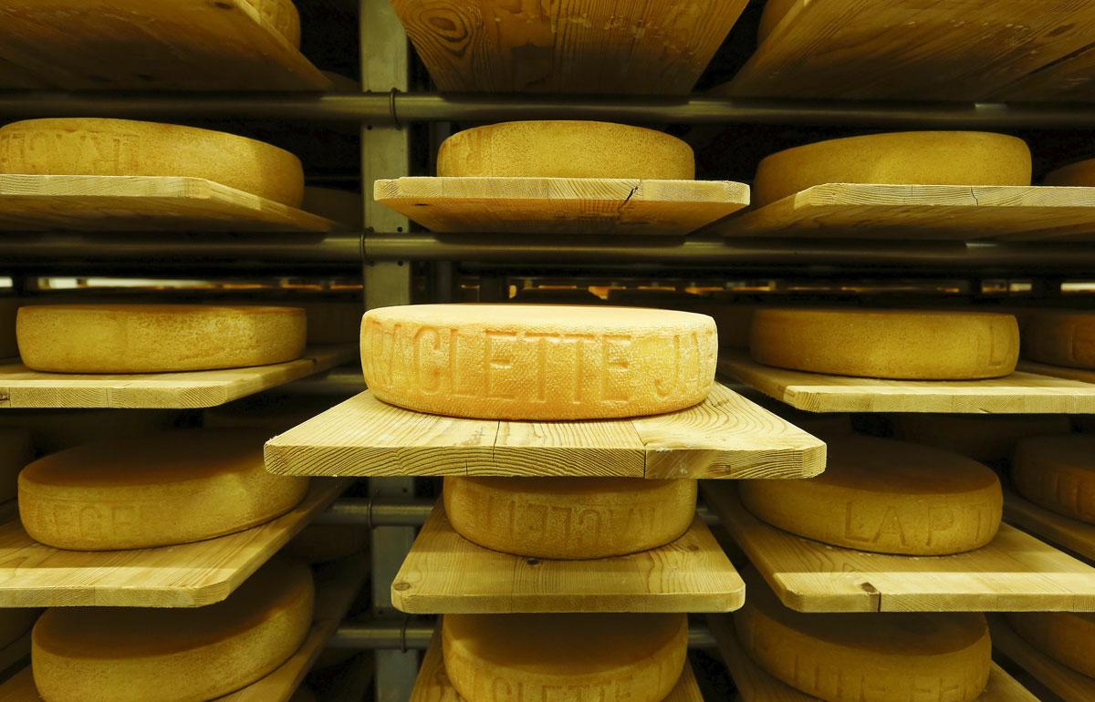 Raclette cheeses made by Swiss cheesemaker Seiler Kaeserei AG mature in storage racks in a former ammunition bunker of the Swiss Army in the town of Giswil, Switzerland.