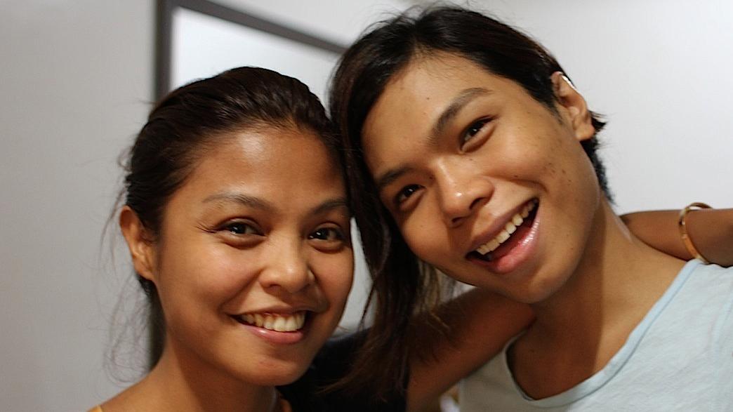 Valerie and Vernon de Guzman (r) are young Catholics, sister and brother, who hope that Pope Francis's message of openness and tolerance will influence the conservative Philippine Catholic Church.