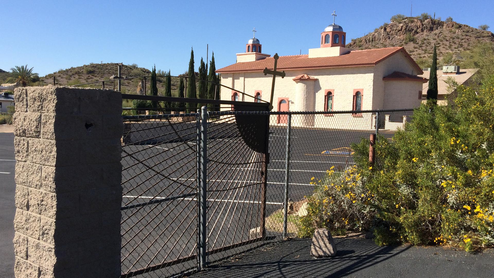 The gate at the St. Nicholas Serbian Orthodox Church in Phoenix was vandalized this past Christmas with graffiti depicting symbols of a Croatian group that historically persecuted Serbs.