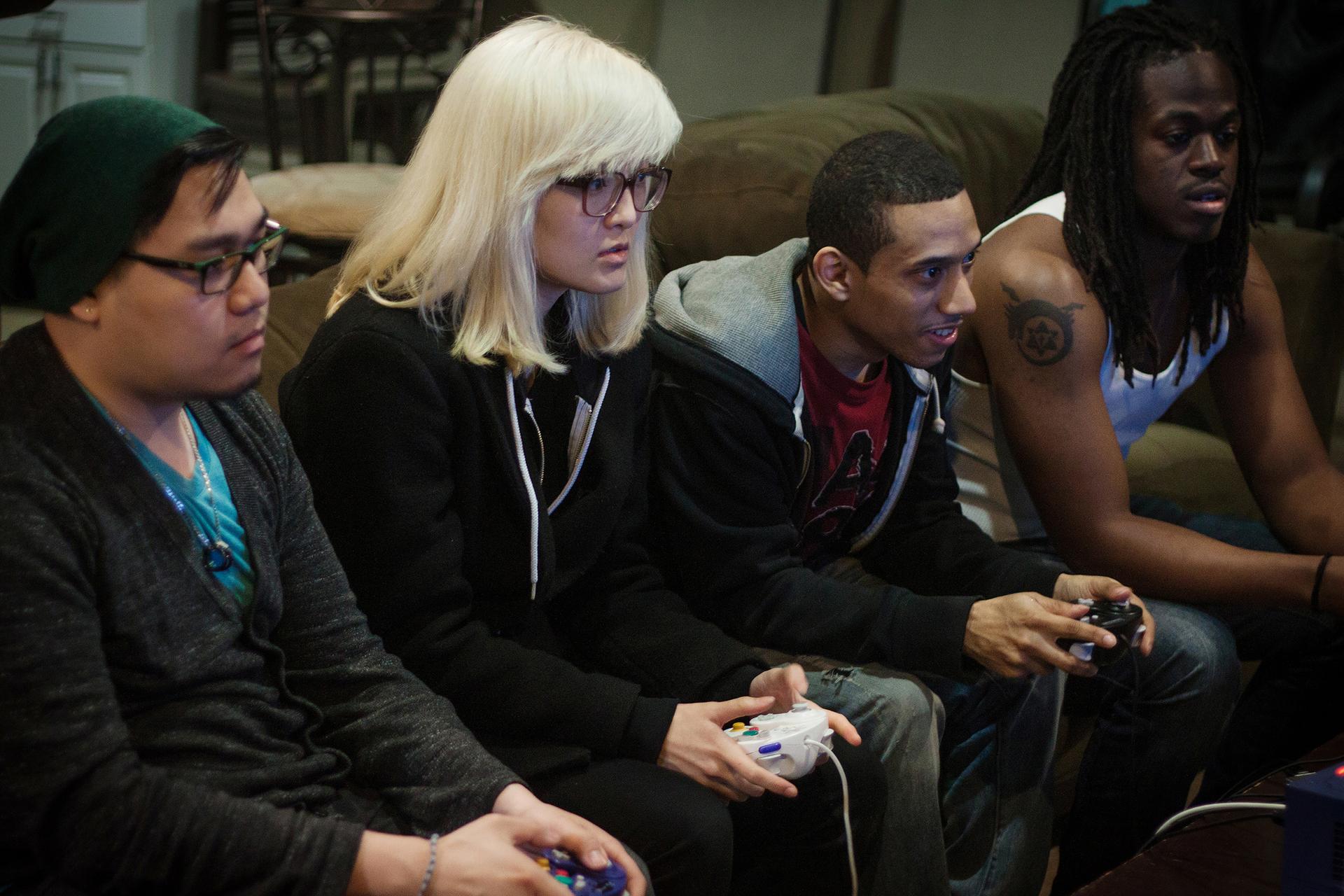 Two two-person teams battle each other in Super Smash Brothers Melee for practice.