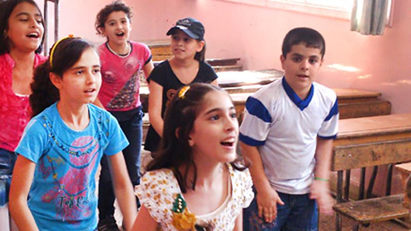 Syrian children play during a Questscope informal education class in Damascus. 
