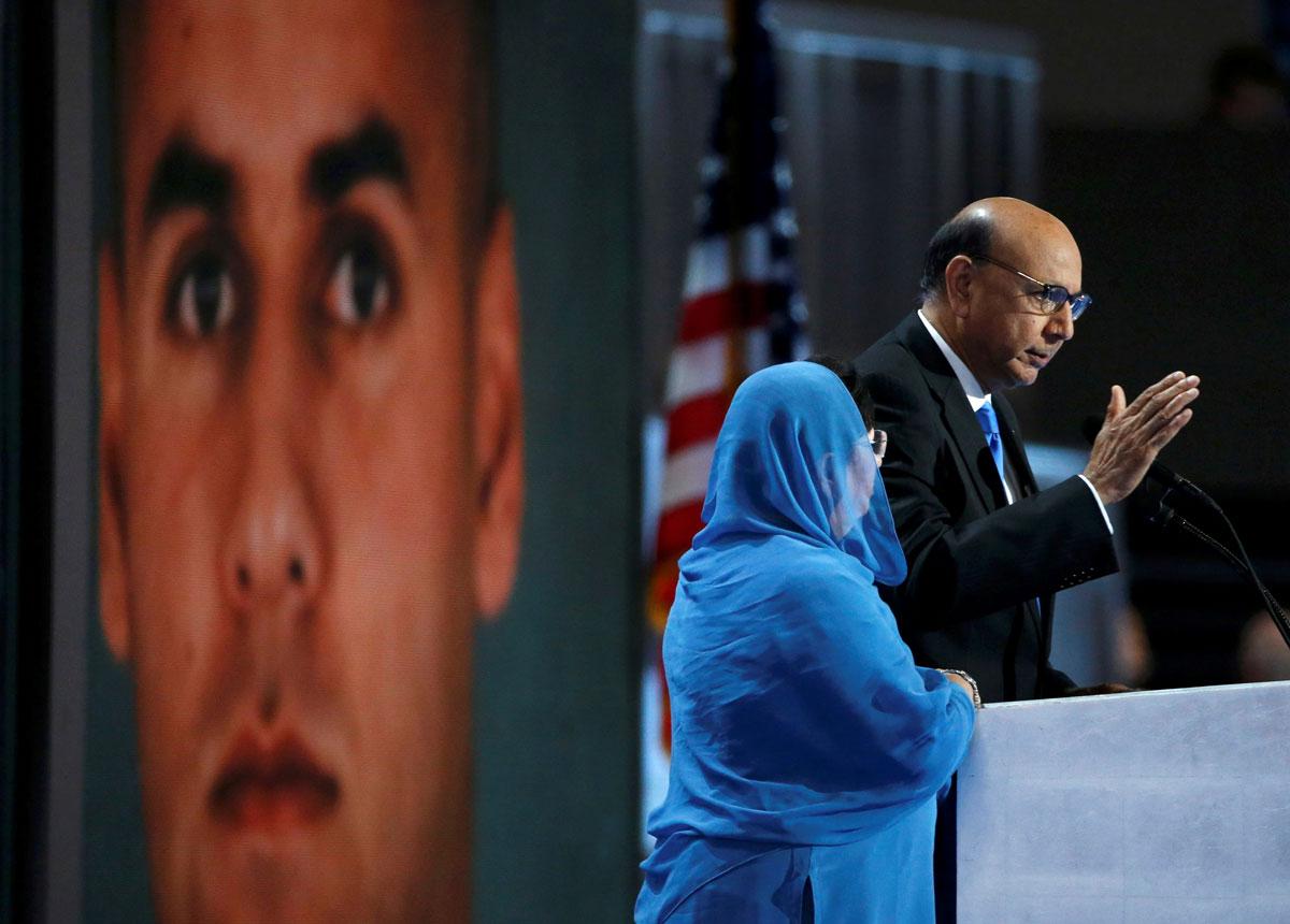 Khizr Khan speaks with an image of his son Humayun in the background. Khan is a Muslim American whose son joined the Army after the Sept. 11, 2001 attacks. Humayun was killed during service in Iraq.