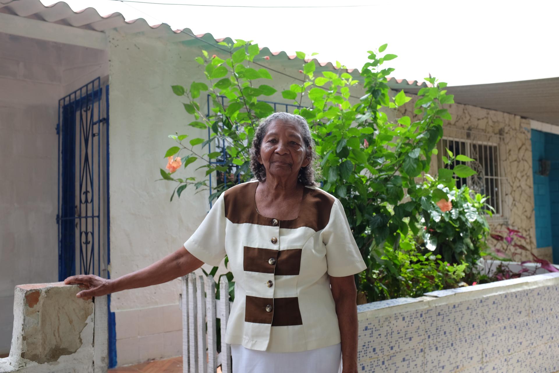 Matilde Isabel Pajaro de Ferias stands in front of her home in the City of Women.