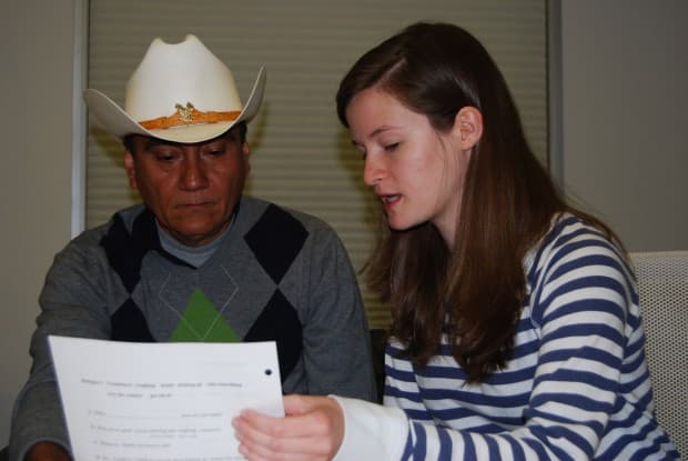 A Google employee tutors one of the company's janitors in a weekly class. (Photo: Jason Margolis)