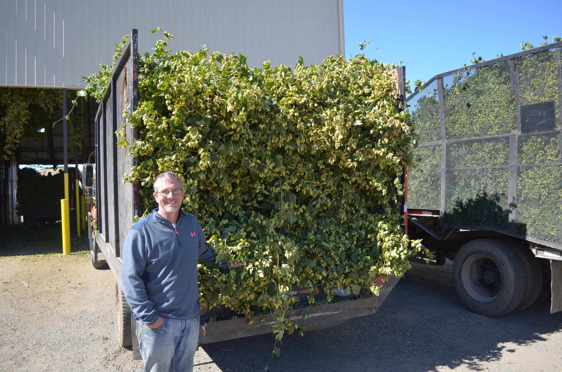 Fourth-generation hops farmer Eric Desmarais is fighting both the impacts of climate change—by switching to water saving irrigation technology—and the cause—by installing drying kilns that use much less fossil fuel energy.