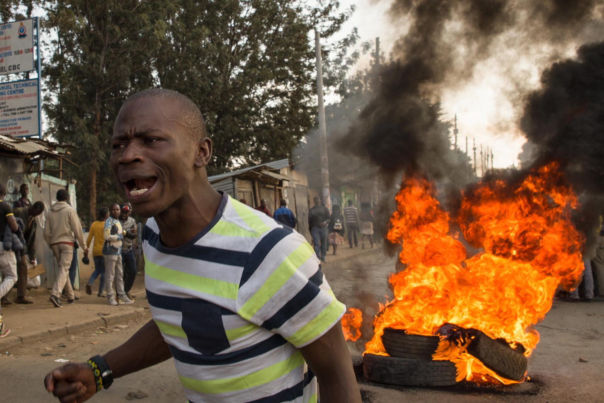 “Uhuru must go!” yells a demonstrator in Kibera, an informal settlement in Nairobi, Kenya. The man blamed current President Uhuru Kenyatta for the lack of jobs and widespread poverty in the area, and demanded that the President step down from office.