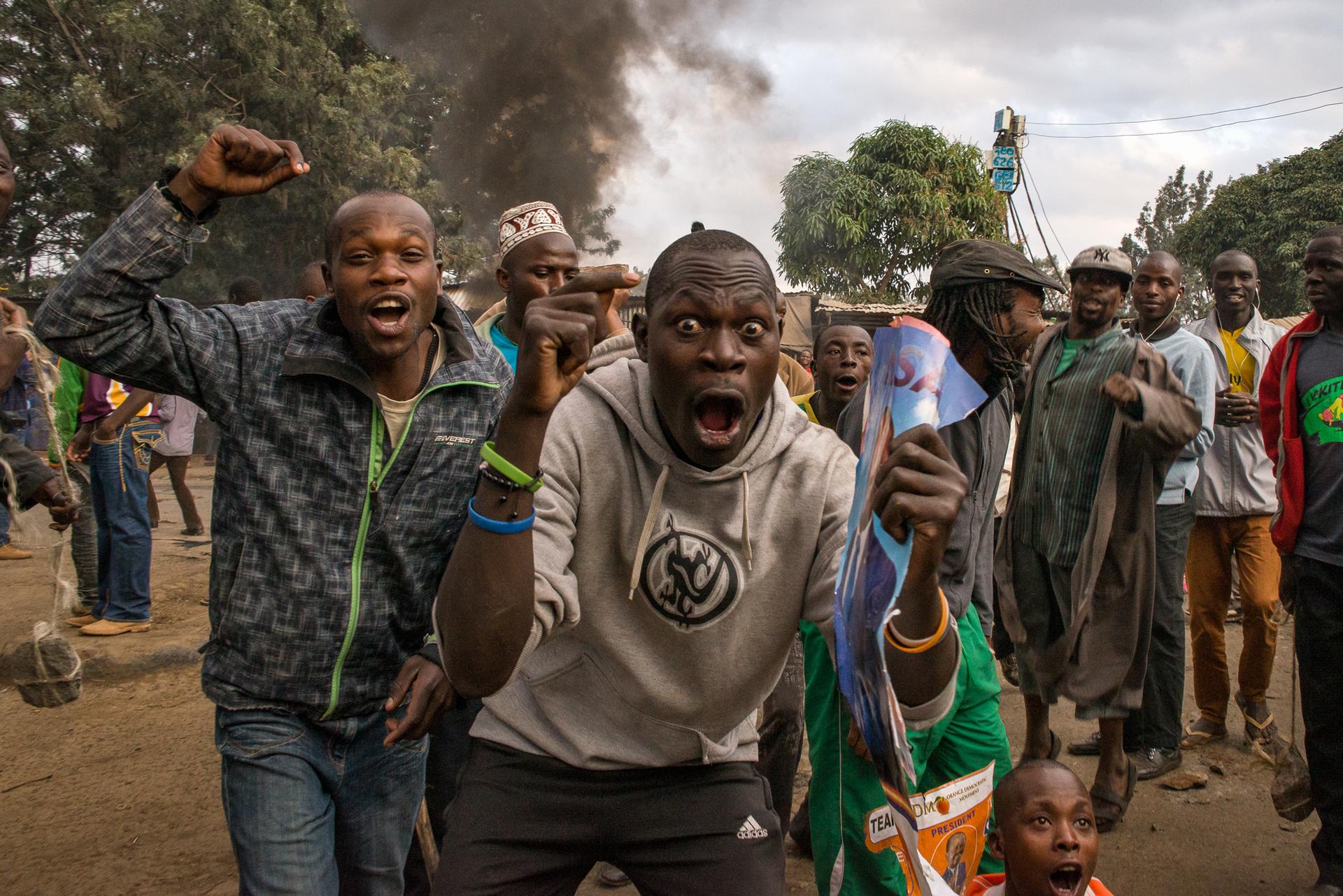 Men yell “Uhuru must go!” during a demonstration in Kibera, an informal settlement of Nairobi, Kenya. Many of the residents support Raila Odinga of the National Super Alliance over current President Uhuru Kenyatta.