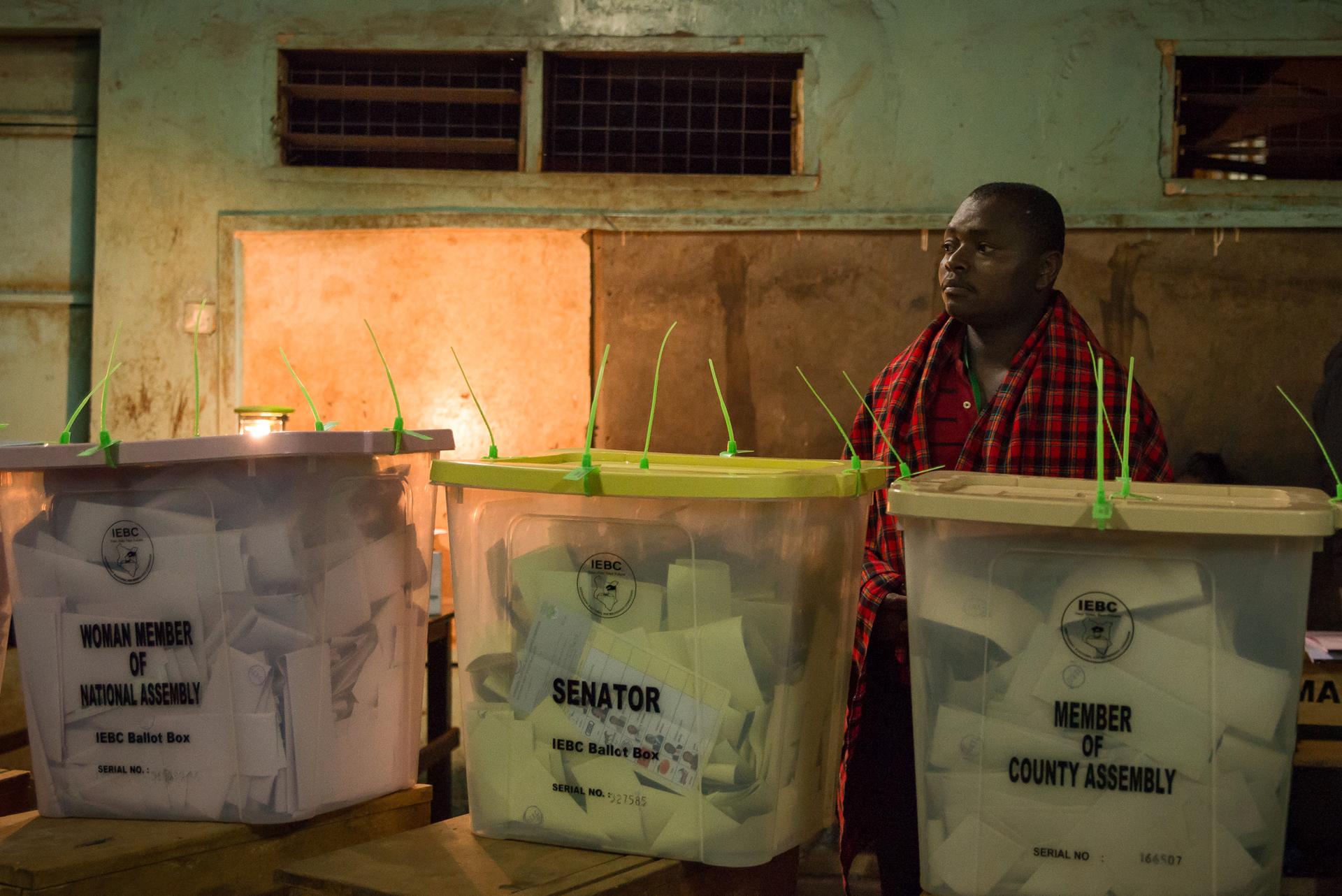An election official wait for confirmation to begin counting votes for Kenya’s next president in Nairobi, Kenya.