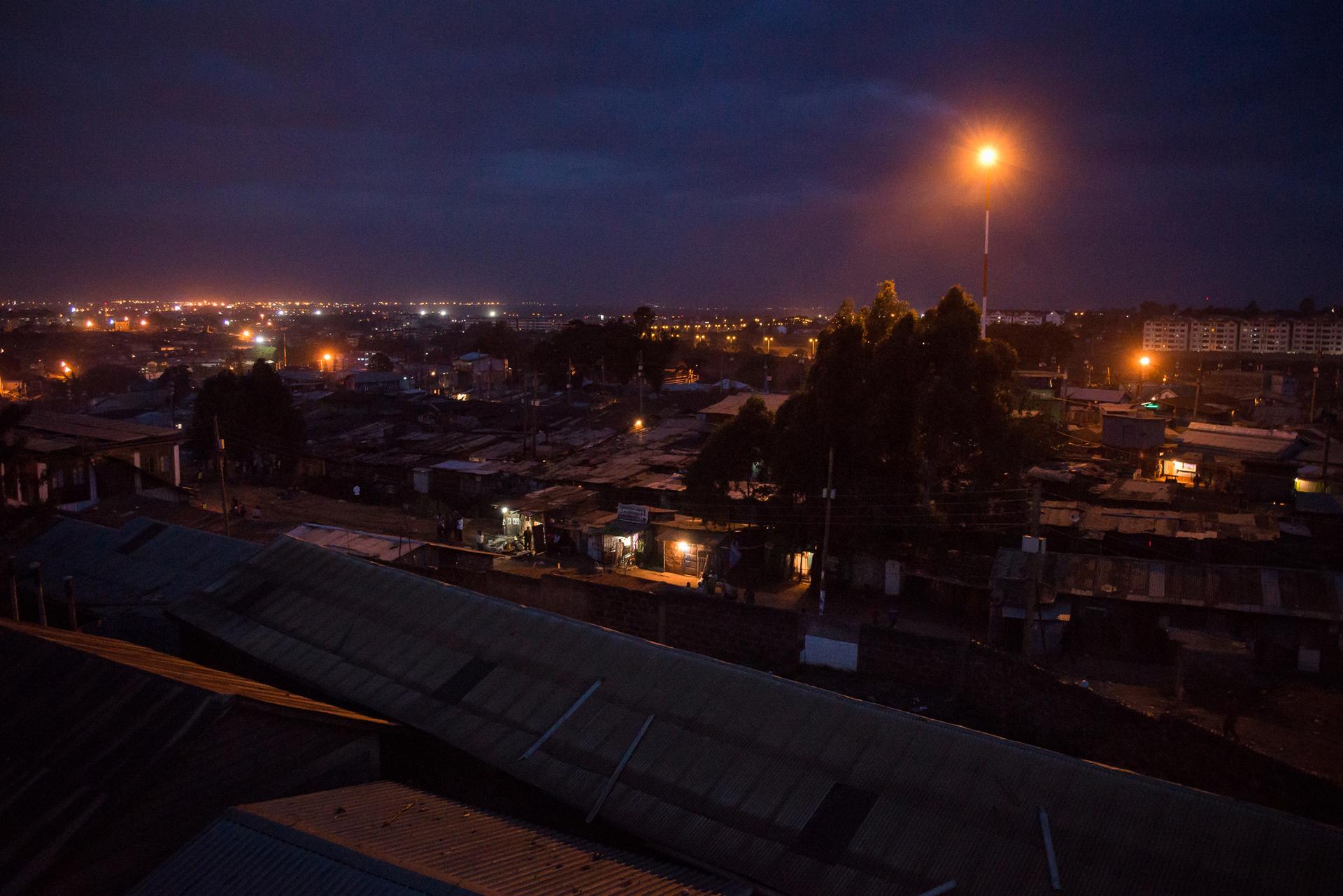 Night falls on Kibera, an informal settlement in Nairobi, Kenya. Much of the 2007/2008 post-election violence occurred in and around Kibera. Tonight, it is quiet.