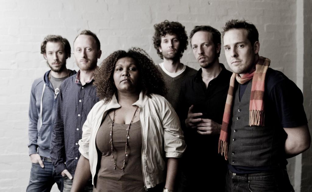 A photo of indigenous Australian singer Emma Donovan and The Putbacks, the Melbourne-based band that backs her.