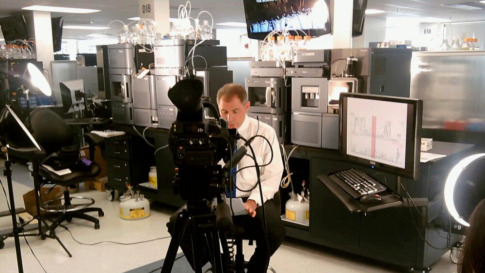 JOVE videographer preps for lab shoot.