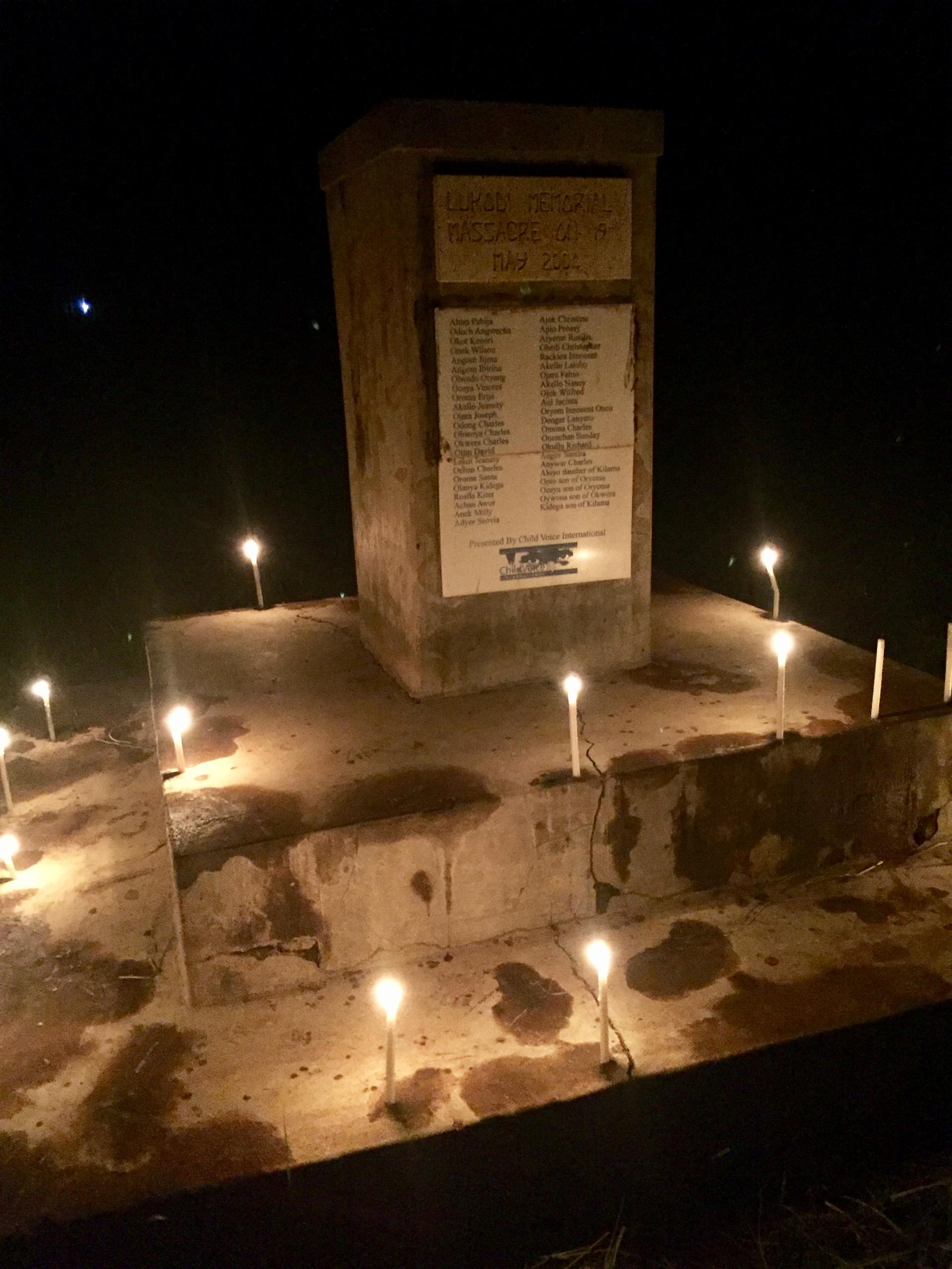 A memorial with candles on it to honor those killed by the Lord's Resistance Army in Lukodi, Uganda.