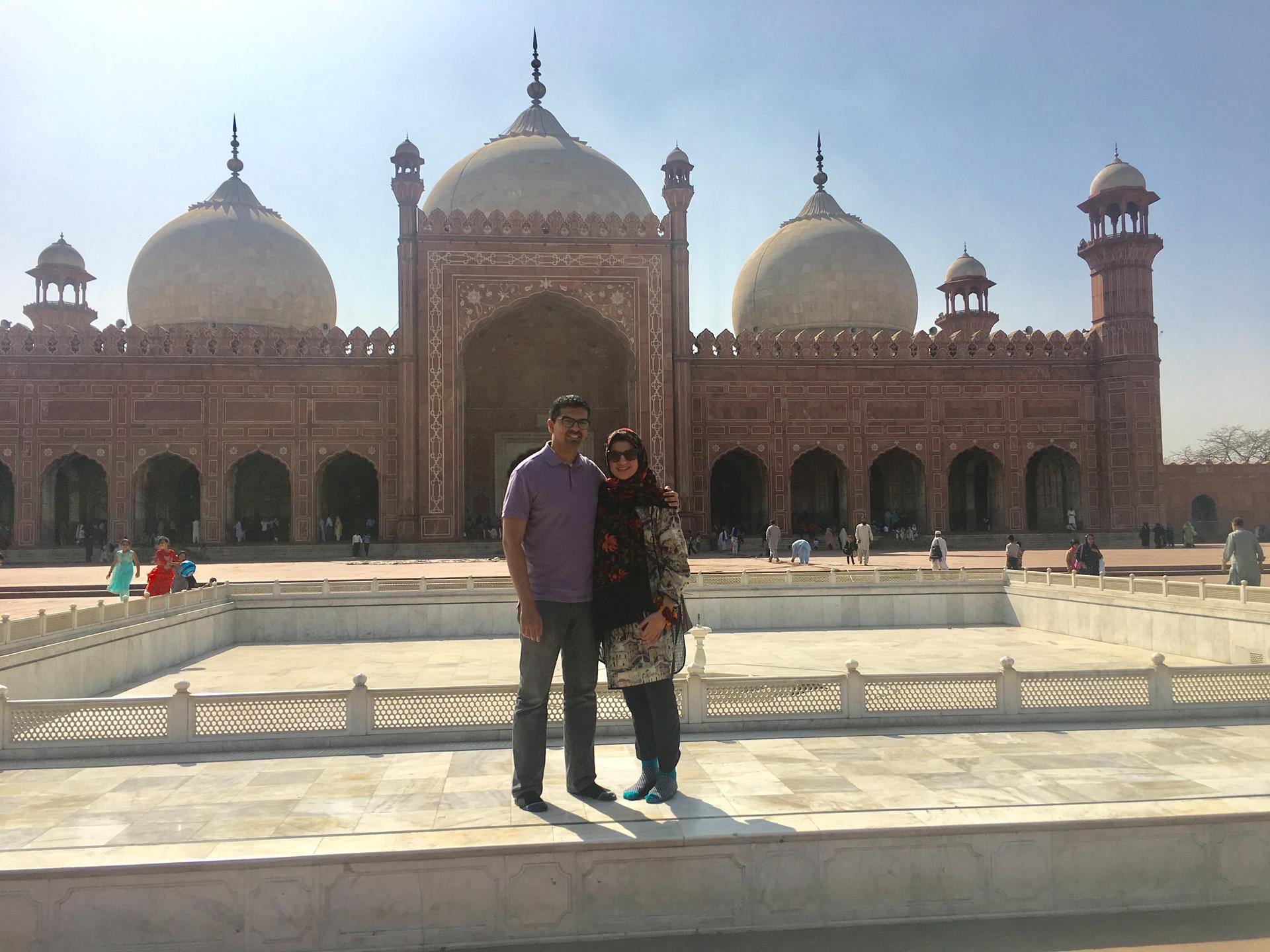 Jalal Baig and wife outside mosque in Lahore, Pakistan