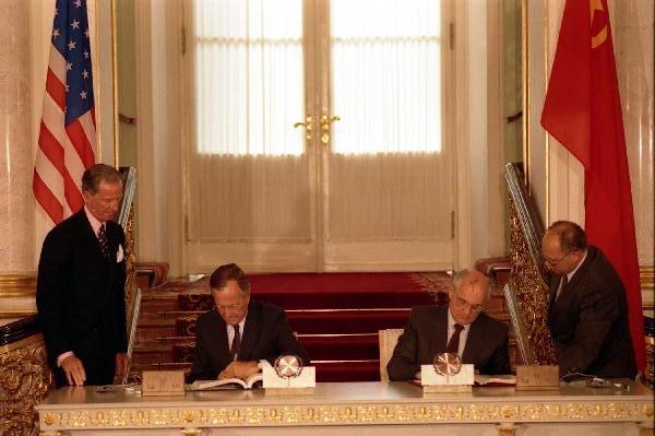 US President George H. W. Bush and Soviet President Mikhail Gorbachev sign the Strategic Arms Reduction Treaty (START) in Moscow, Soviet Union, on July 31, 1991.