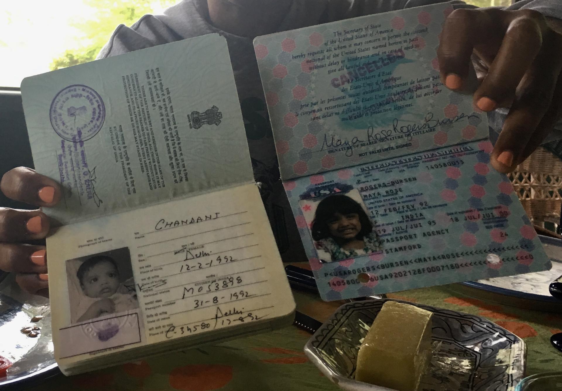 Maya Rogers-Bursen, 26, holds her old Indian passport and a newer American one, each with different names. 