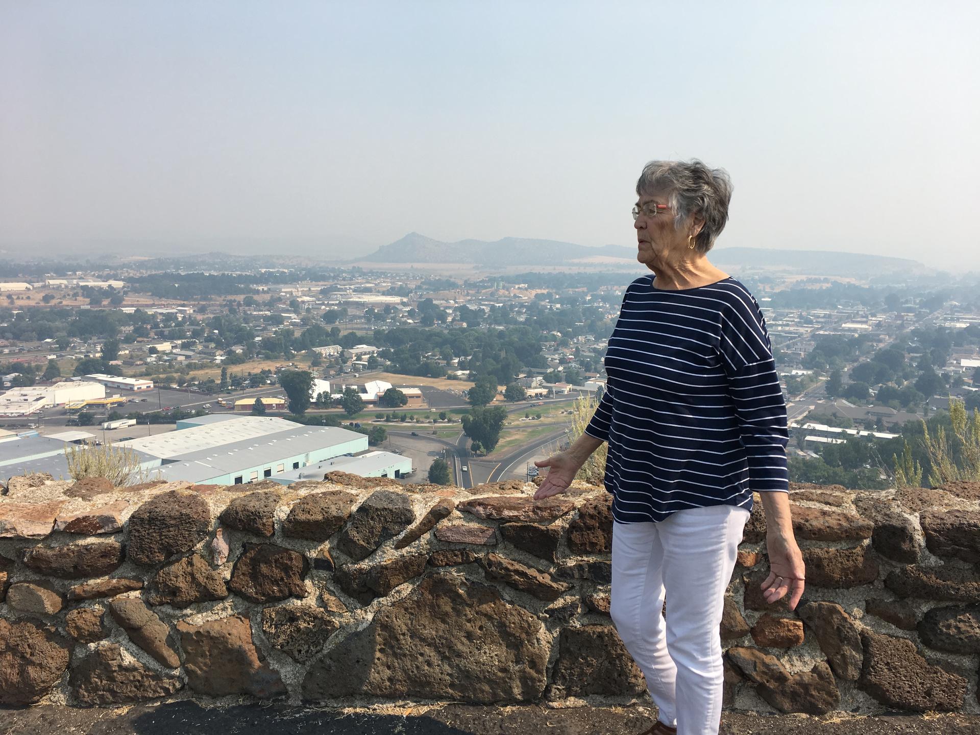 Mayor Betty Roppe stands above the valley at the heart of Prineville, Oregon.