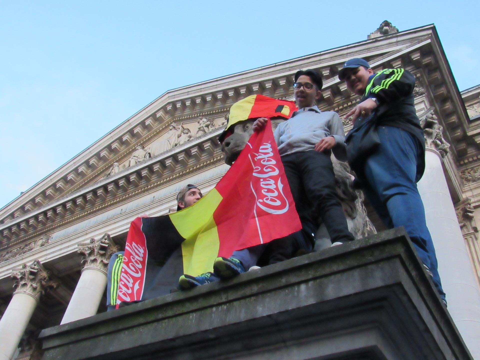 Youth display a modified Belgian flag during a rally at the old Belgian Stock Exchange.