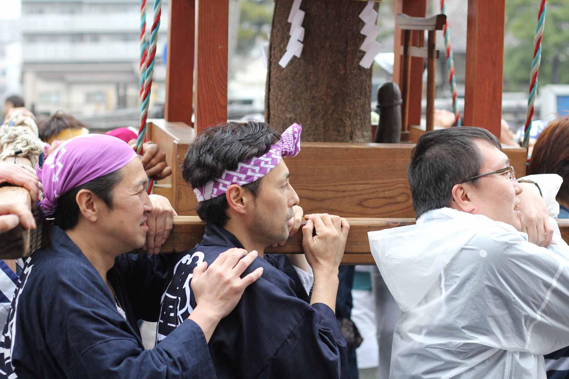 Parade goers carry a penis shrine during the Kanamara Festival.