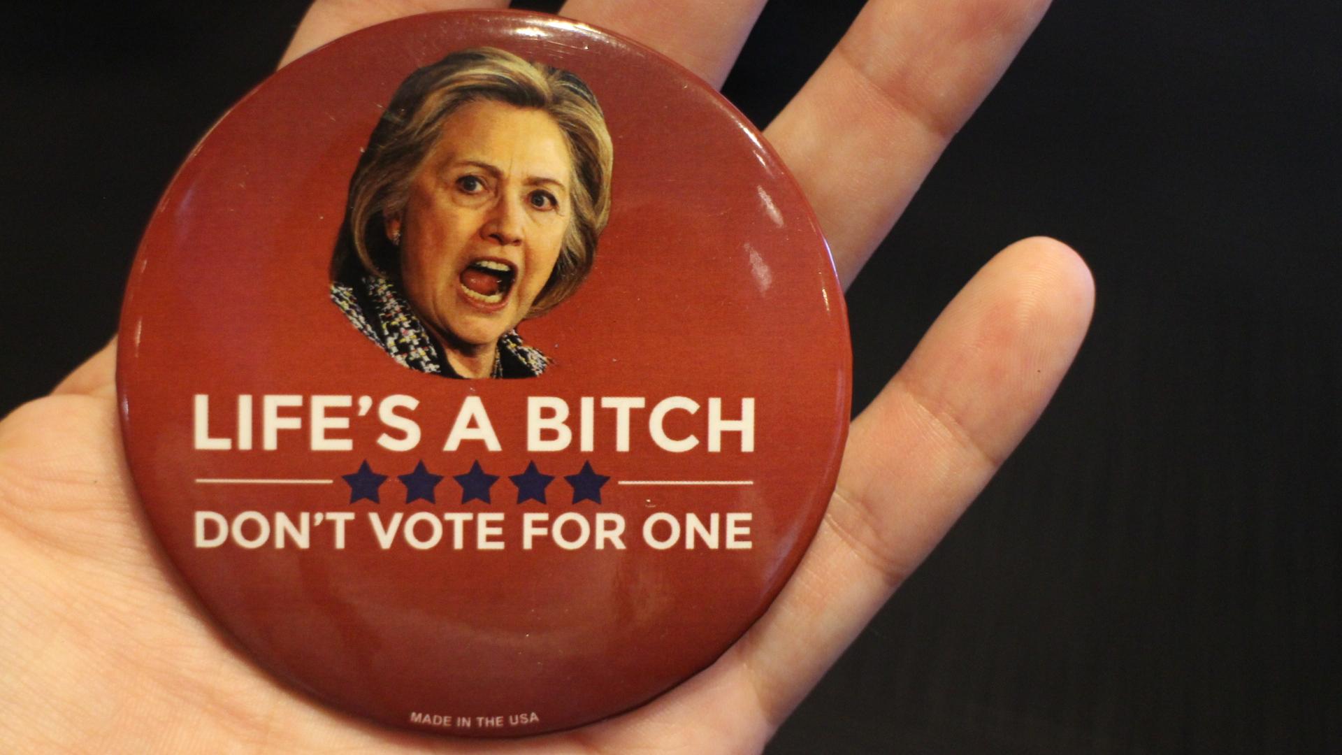 Buttons and T-shirts sold outside the Republican National Convention referred to Democratic candidate Hillary Clinton as a 