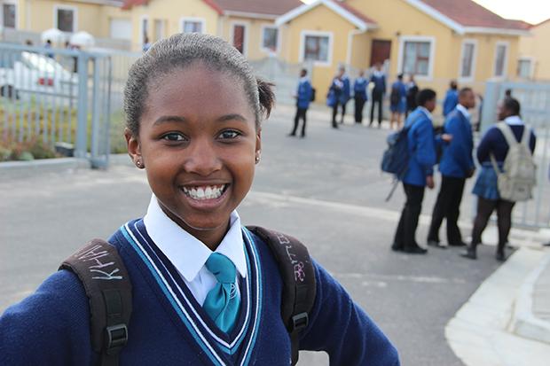 Ninth-grader Khanyisile write notes of positive reinforcement on her backpack. (Photo: Anders Kelto)