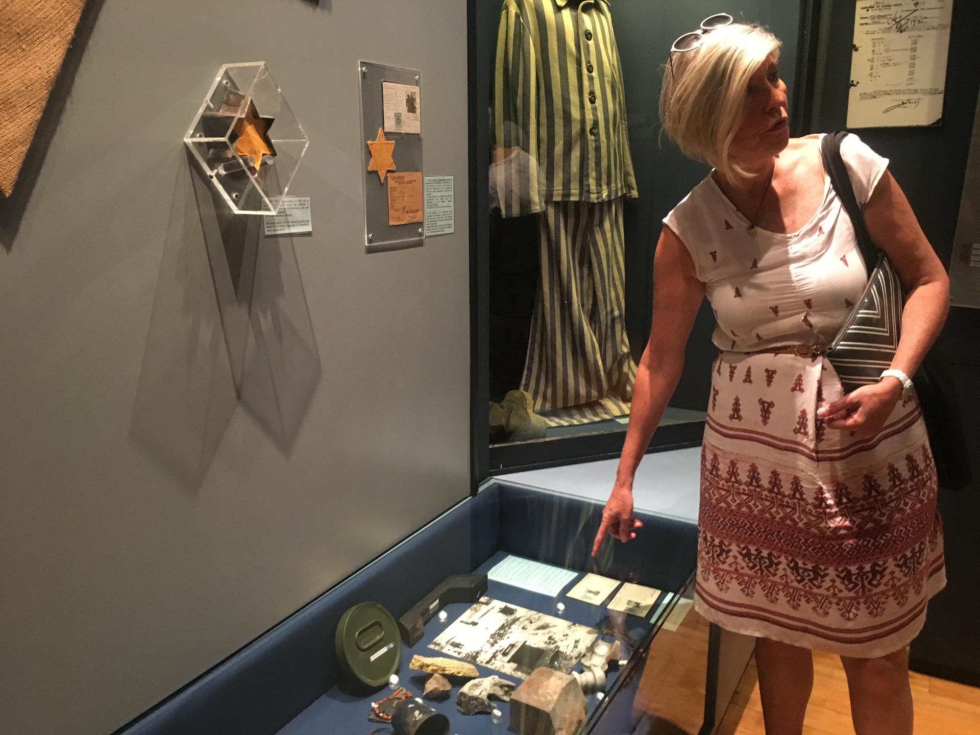 Inside the Jewish Museum of Thessaloniki, Hella Kounio Matalon points to items collected by her father from Auschwitz, after he was liberated. He was among very few of Thessaloniki's Jews to survive the Holocaust.