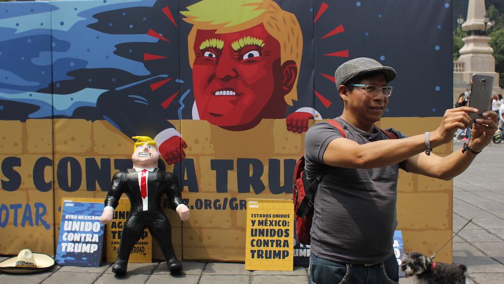 Piñatas and billboards against Donald Trump were one of Mexico City's latest efforts to get out the vote in the United States.