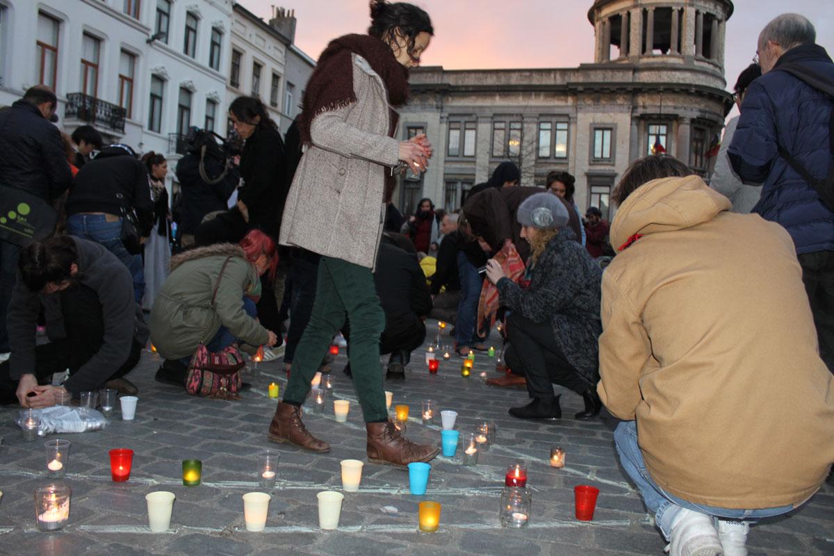 Everyone joined in to light the candles as the sun set in the plaza outside the municipal building.