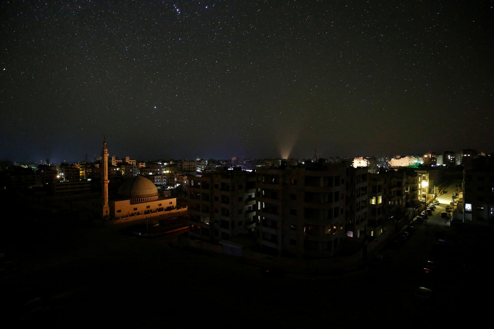 The city of Idlib is seen at night.