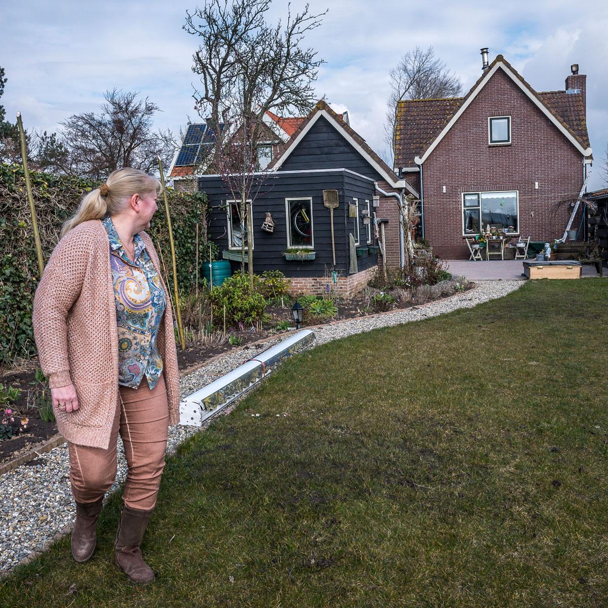 Anneke van Lelieveld's house sits atop a dike near a 