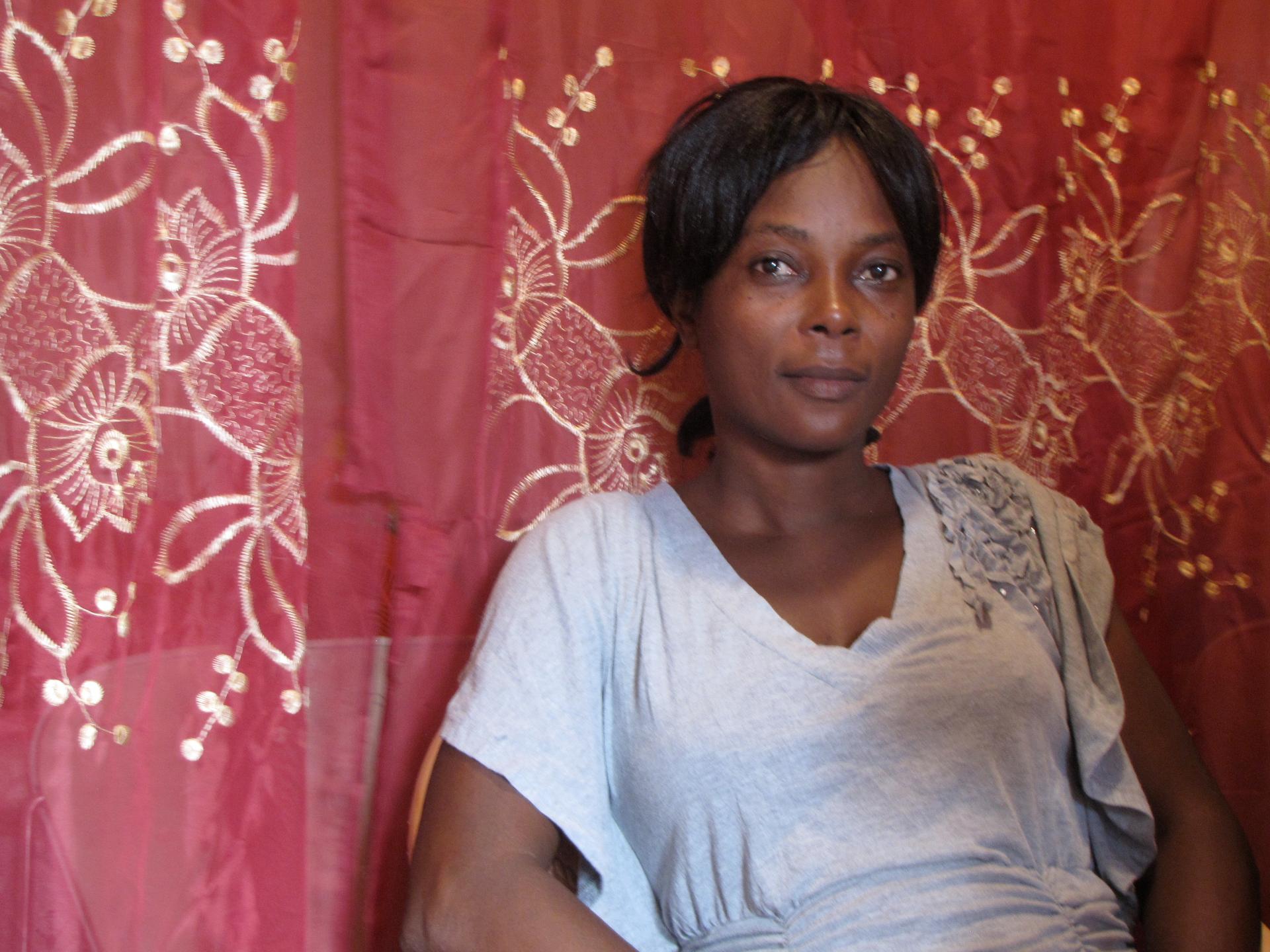 Lucilia Gérome Petit-Frère, President of the Association of Women of Potential of Village la Difference, sits in her living room in the village.