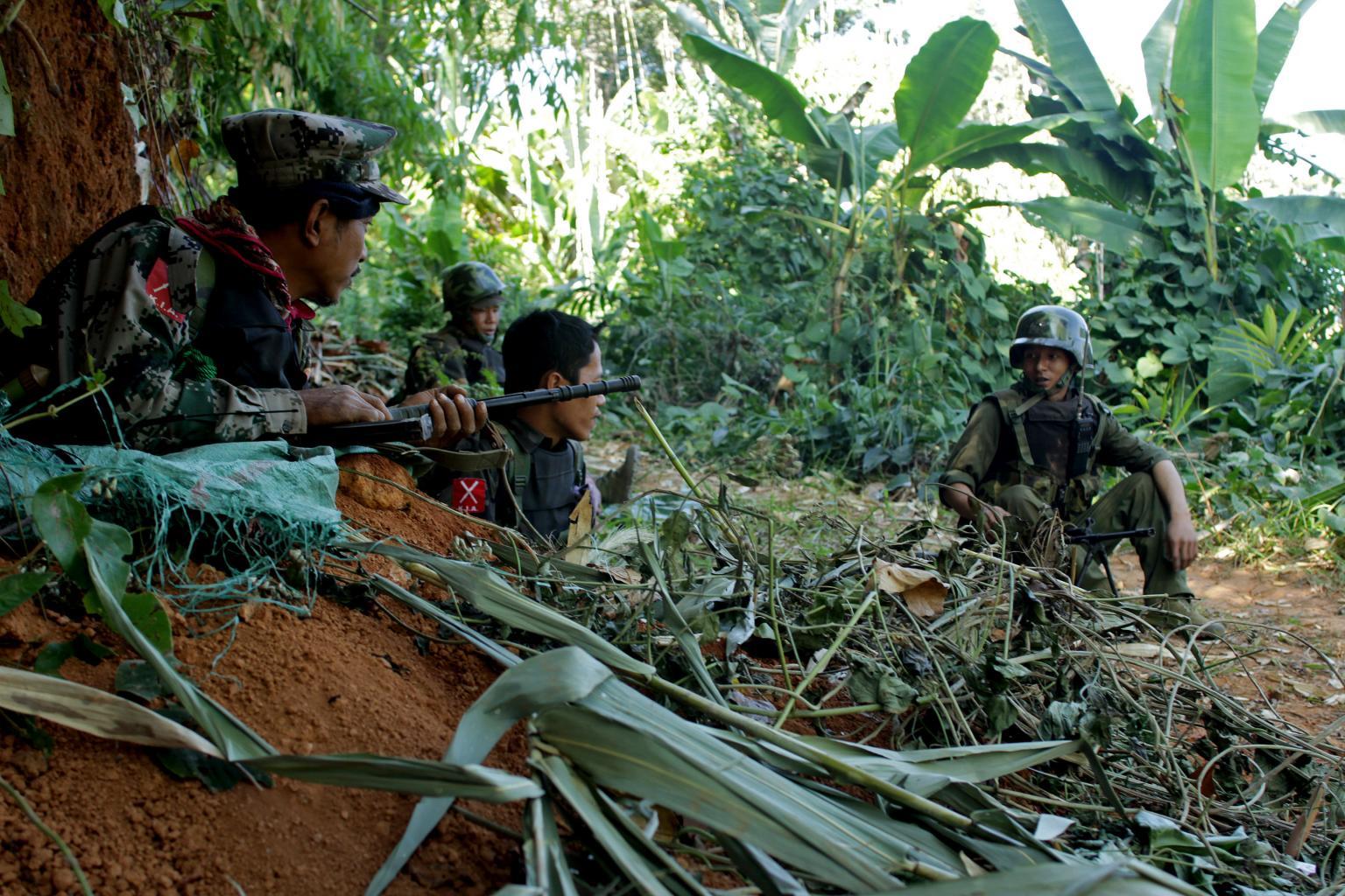 Rebel Kachin Independence Army (KIA) 3rd Brigade soldiers secure an area on Hka Ya mountain in Kachin province on Jan. 20, 2013. Kachin ethnic minority rebels in war-torn northern Myanmar accused the military of launching a fresh attack on that date, just