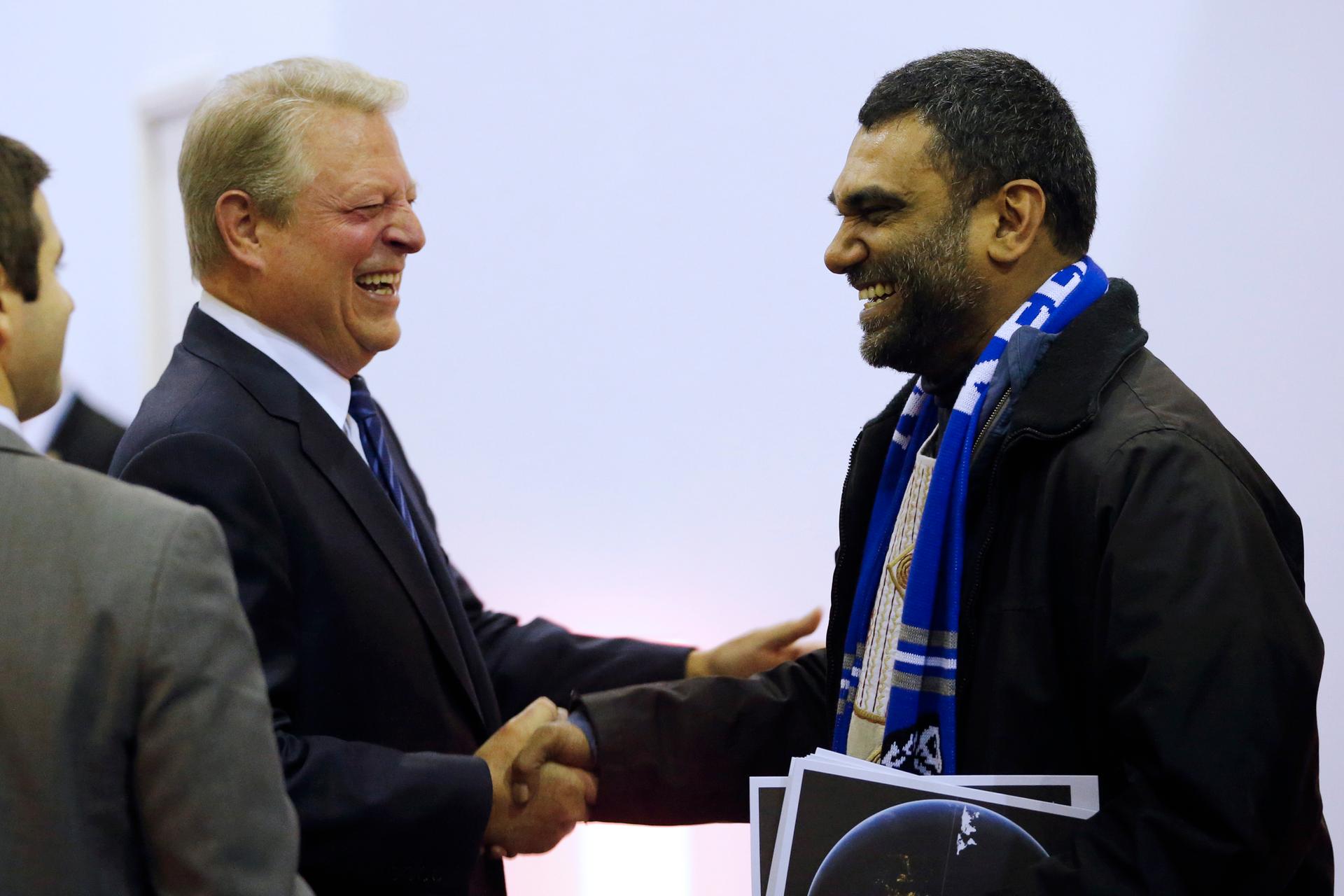 Al Gore (L), former US vice president and Climate Reality Project chairman, and Greenpeace International Director Kumi Naidoo, during the World Climate Change Conference 2015, December 10.