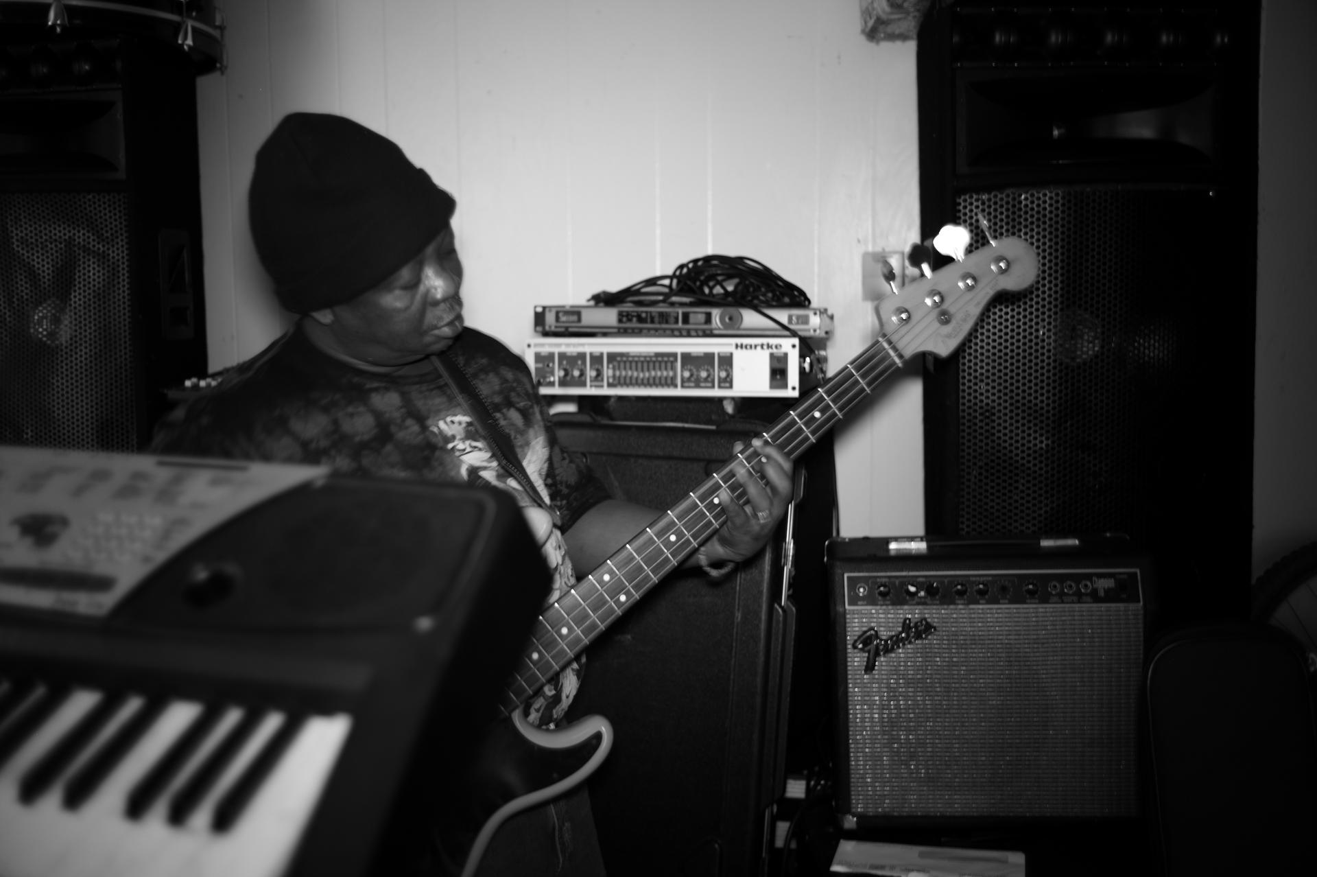 Reuben Koroma of Sierra Leone’s Refugee All-Stars practices the bass guitar at his temporary home in Providence, Rhode Island.