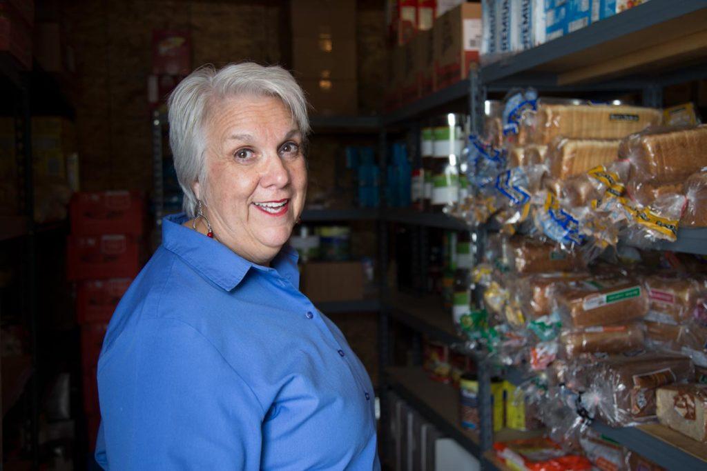 Janet Wilkerson, CAAIR’s founder and CEO, shows off the pantry that feeds the participants in her recovery program.