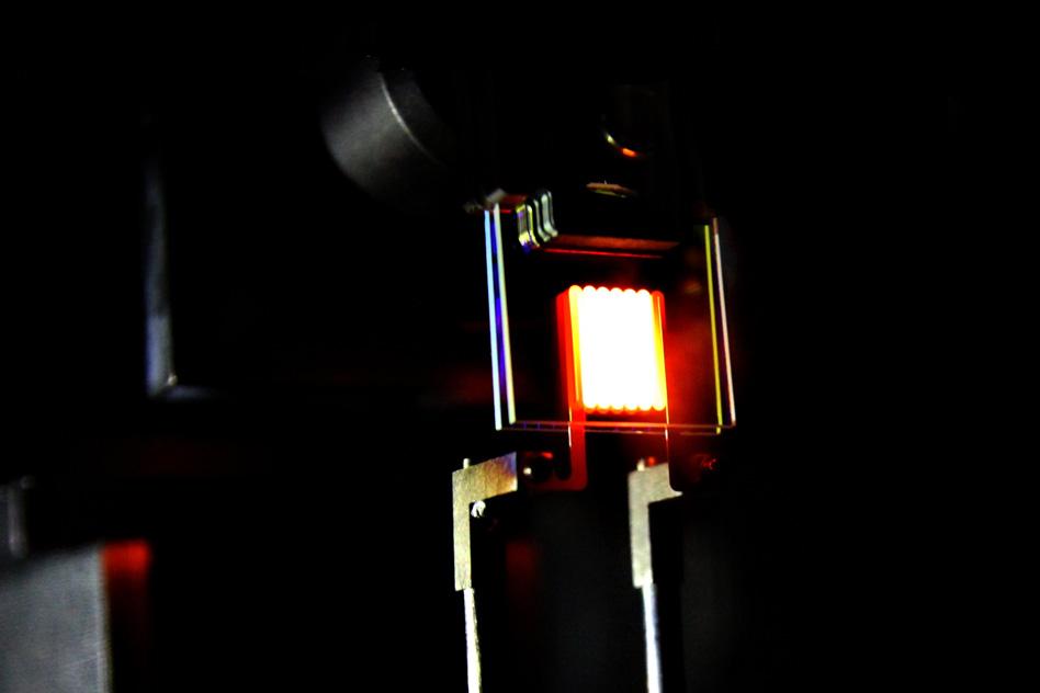 A proof-of-concept device built by MIT researchers demonstrates the principle of a two-stage process to make incandescent bulbs more efficient. This device already achieves efficiency comparable to some compact fluorescent and LED bulbs. Photo courtesy of