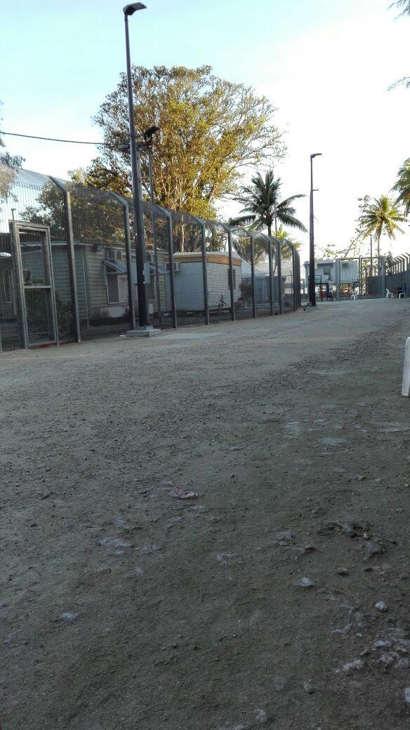 The wire fence that surrounds the Australian-funded immigration detention camp on Manus Island, Papua New Guinea, where Aziz has been held since October 2013.