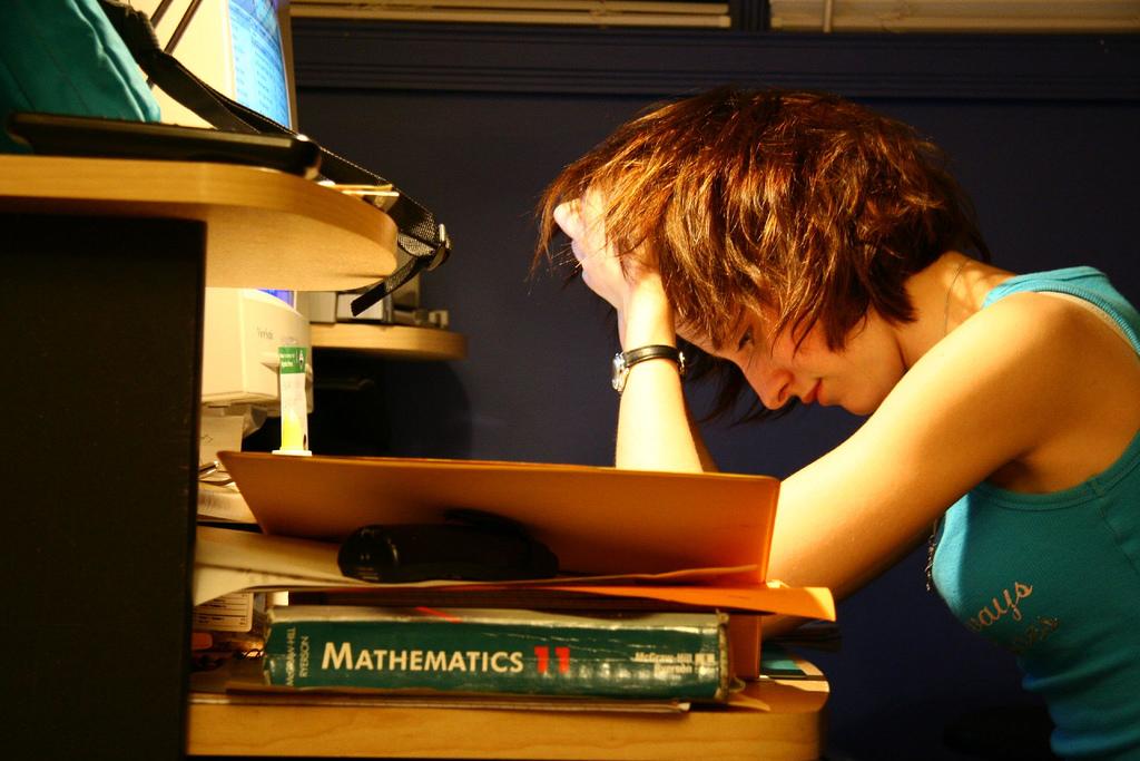 A young woman studying math.