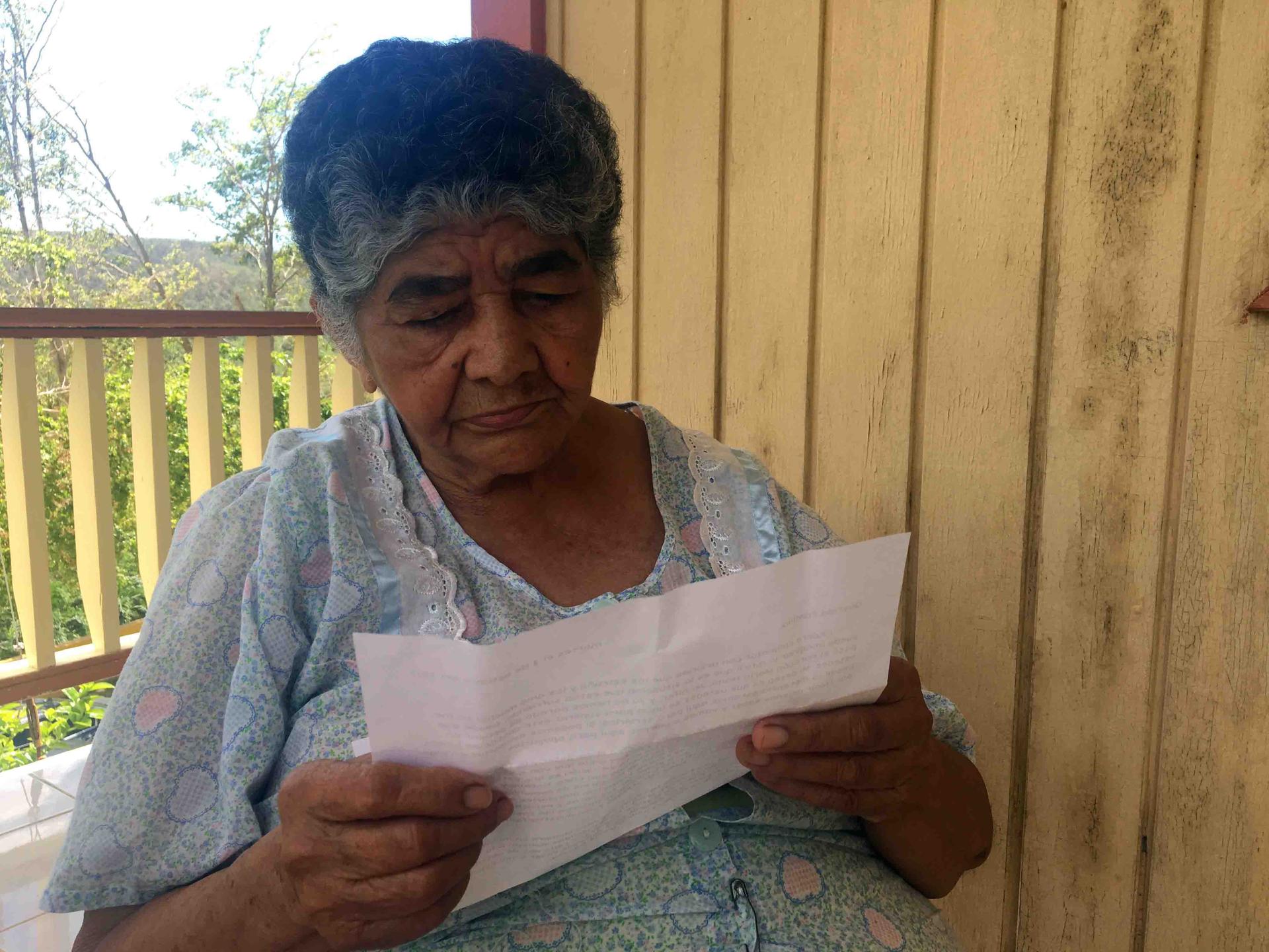 Close up of elderly woman reading a letter