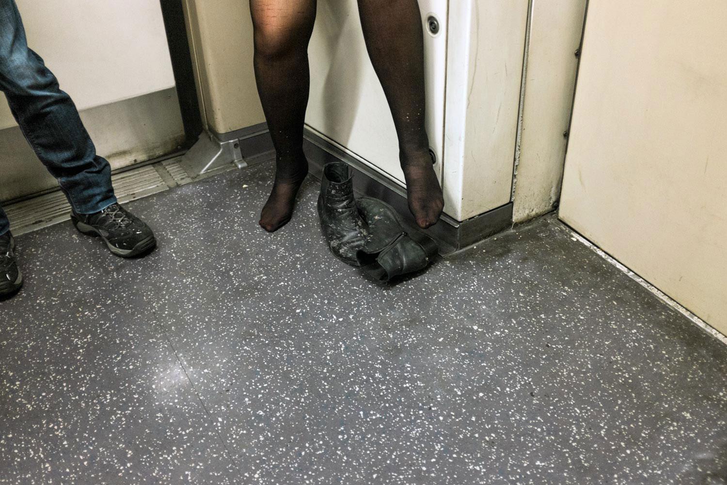 As the night wore on the time for dancing shoes came and went. This woman clearly felt at ease as she rode the Central Line west in the direction of White City.