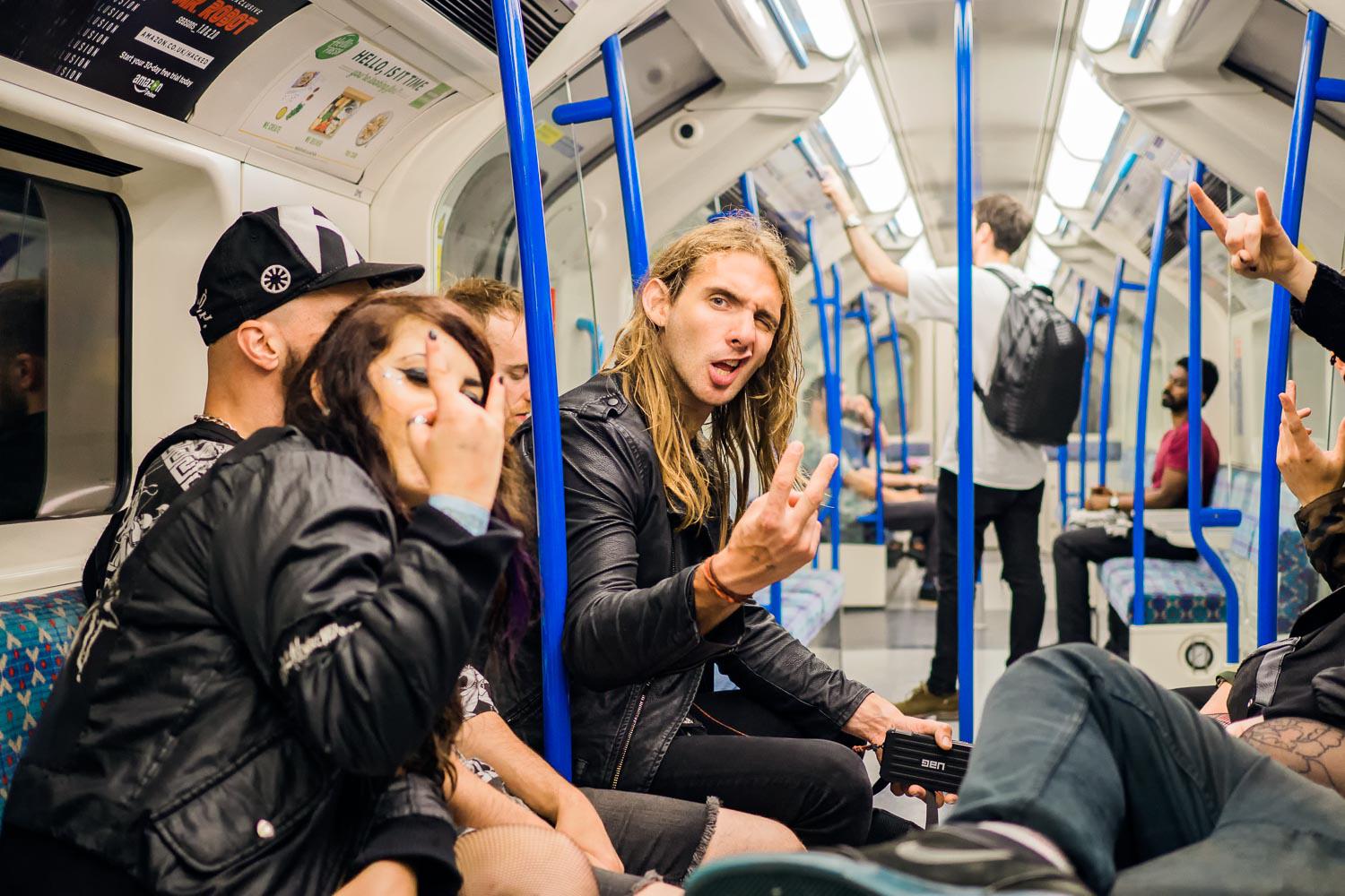 I approached this group of rowdy punks on the Victoria line train as it headed under the Thames toward north London. They were more than happy to act up toward the camera. They were on the way home after a big night out in south London. Drinking on the Tu