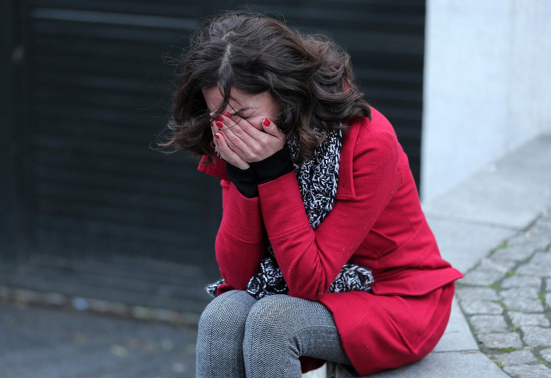 A former employee of the Reina nightclub reacts outside following an attack by a gunman in Istanbul.