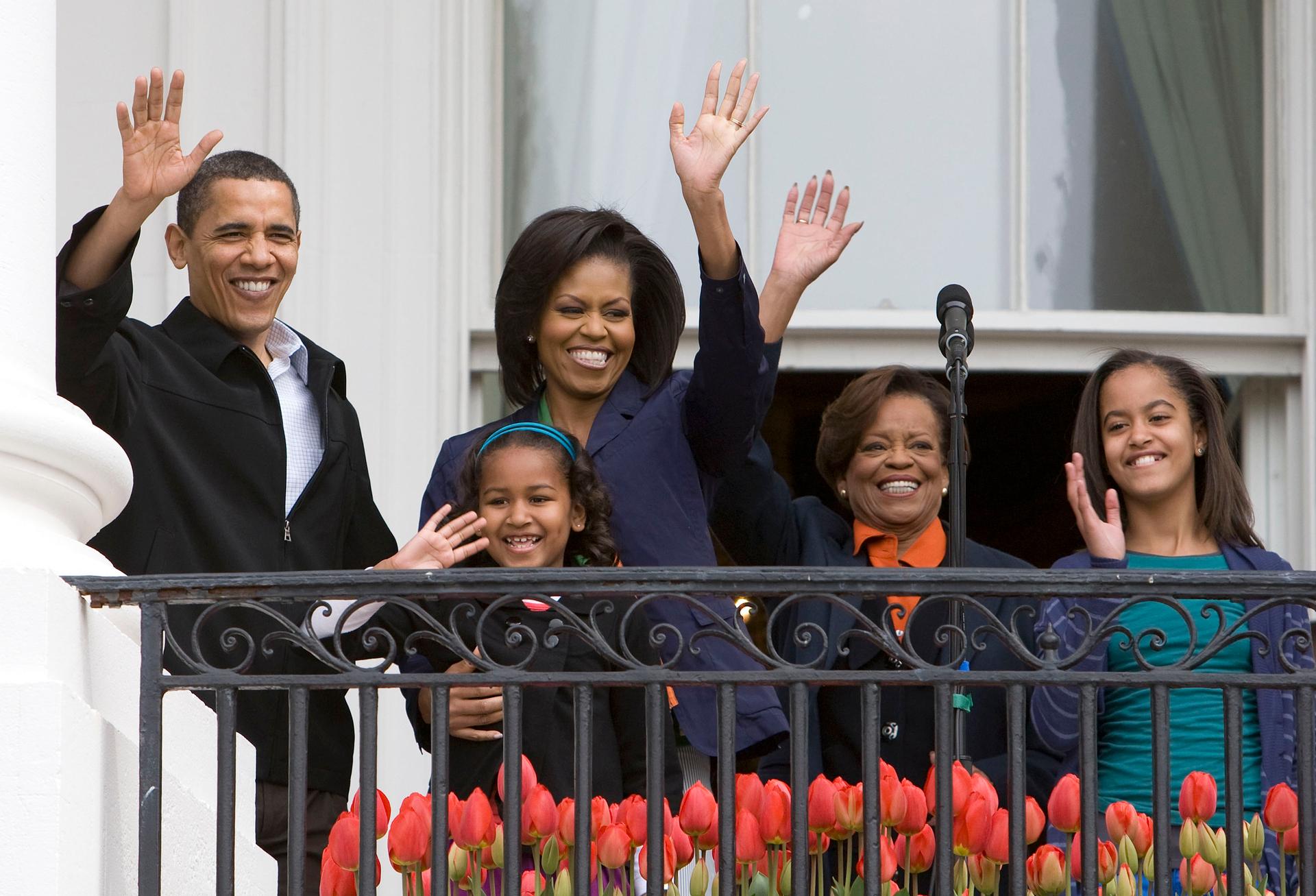 From a bungalow in Chicago to the White House. Michelle and the first family waves from the Truman Balcony, 2009.