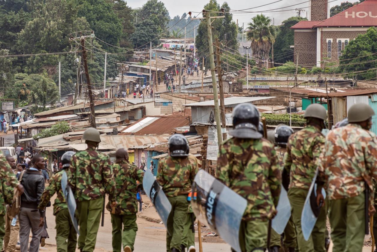 Kenyan anti-riot police prepare to approach opposition demonstrators in the Kibera neighborhood of Nairobi, Kenya.