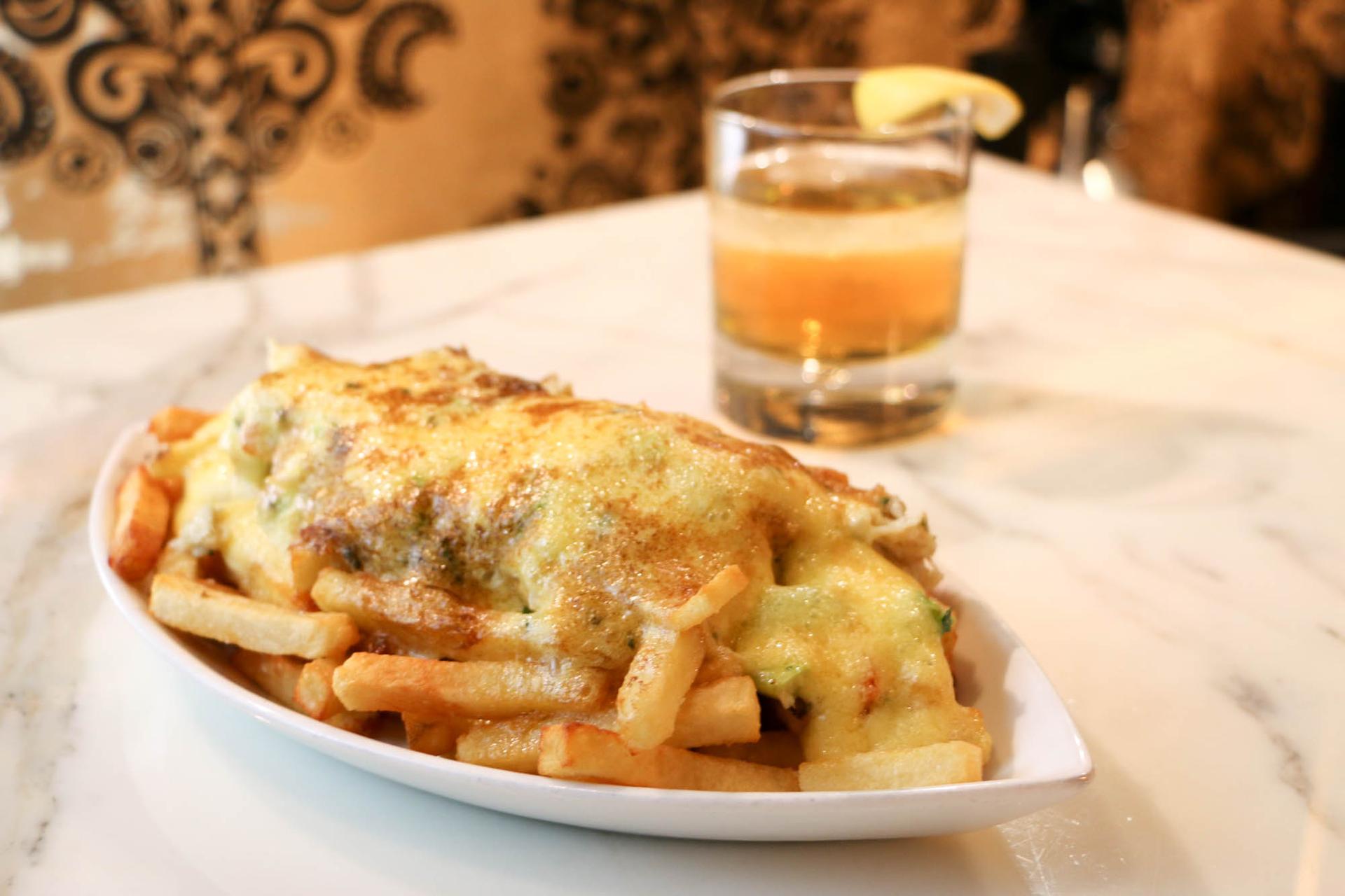 The Barrymore's poutine: fresh crab meat, asparagus, and béarnaise sauce over the top.