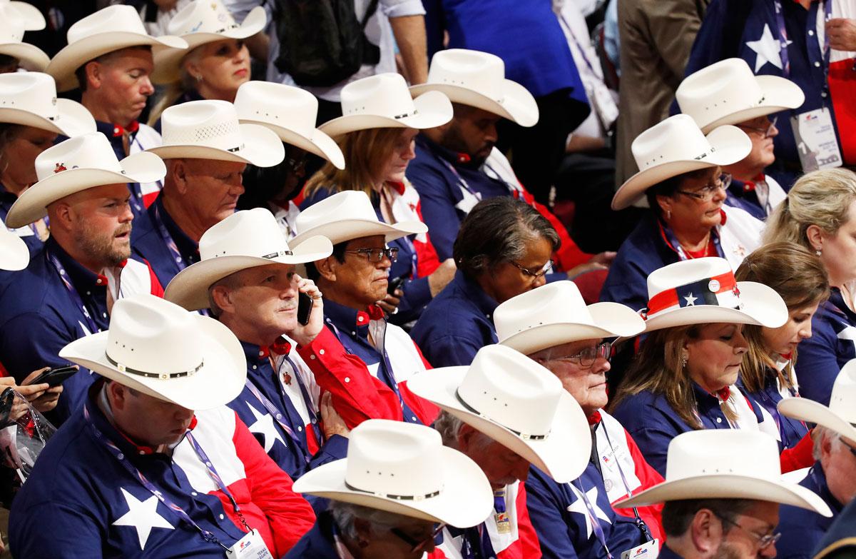 Members of the Texas delegation sit in their seats at the start RNC.