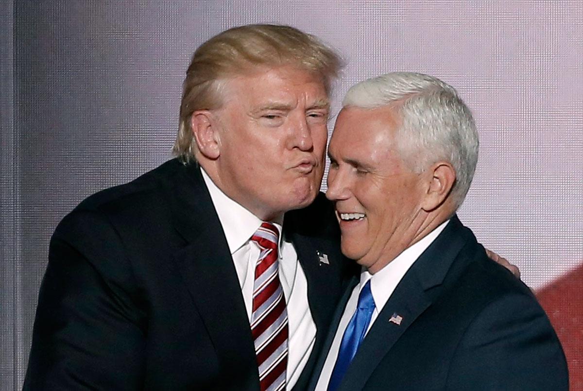 Republican US presidential nominee Donald Trump greets vice presidential nominee Mike Pence after Pence spoke at the RNC.