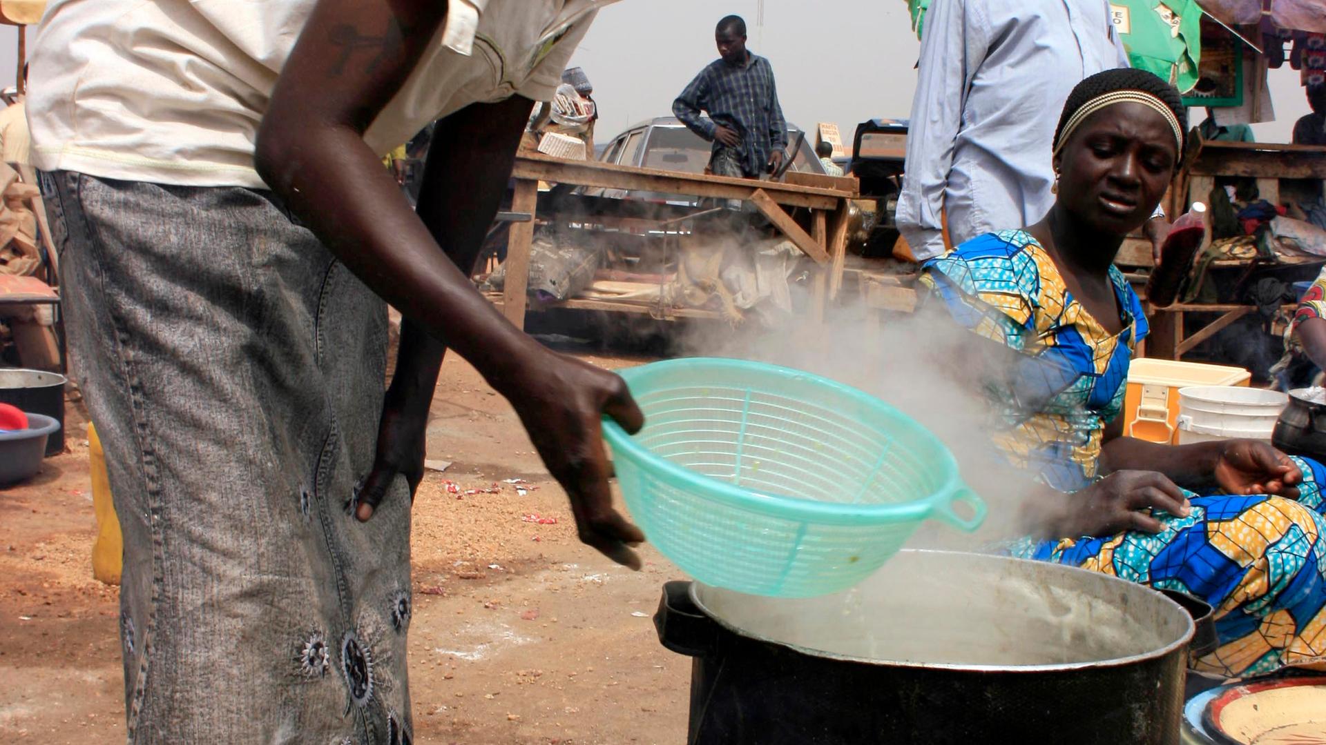 A cook prepares jollof rice in Kano, NIgeria.