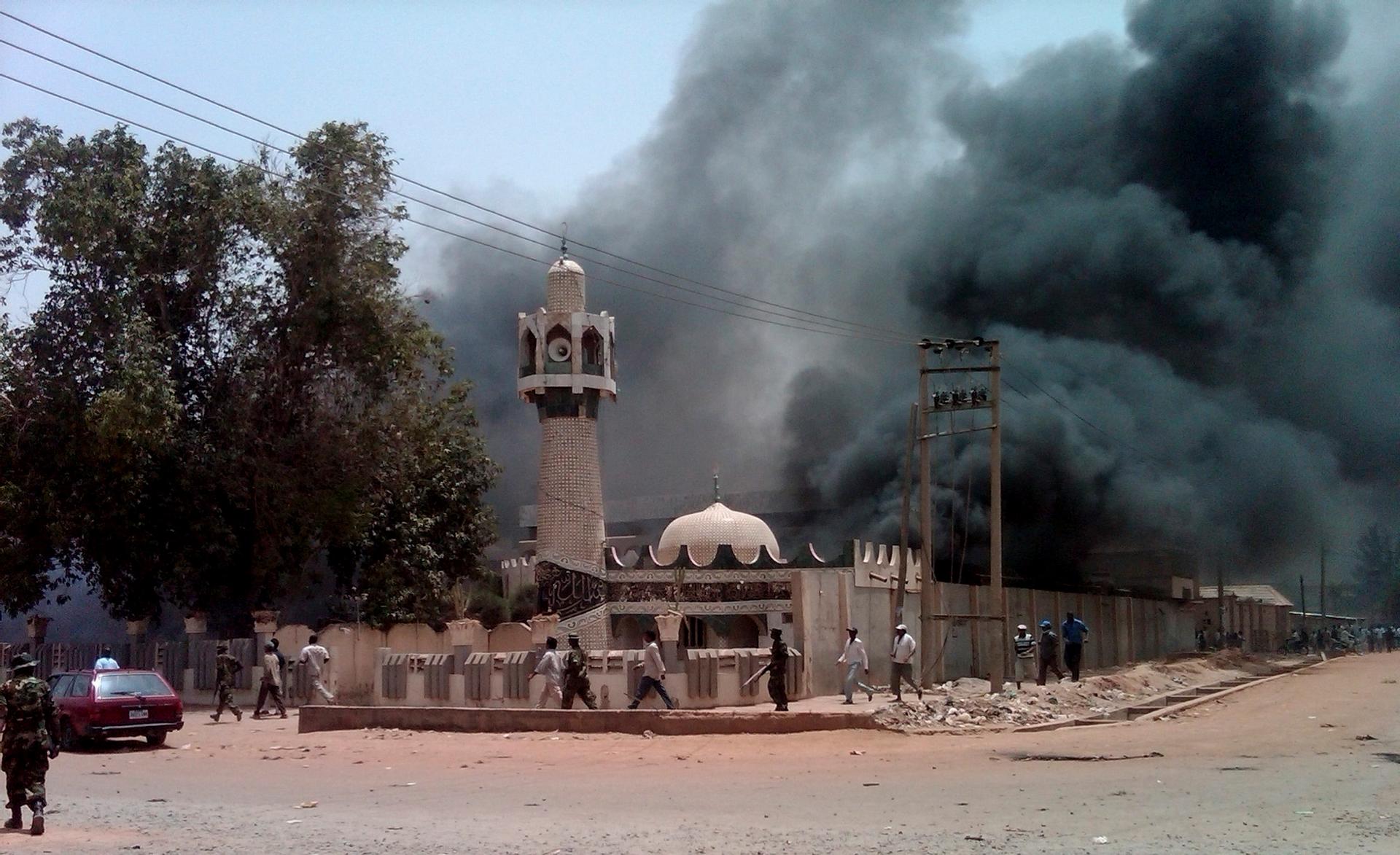 A mosque is set on fire by protesters after the release of the presidential elections results in Kano, northern Nigeria, April 18, 2011