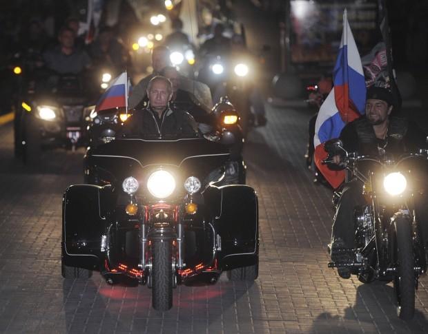 Russian Prime Minister Putin rides with motorcycle enthusiasts during his visit to a bike festival in the southern Russian city of Novorossiisk. (Photo: Alexsey Druginyn/RIA Novosti/Pool/ Reuters)